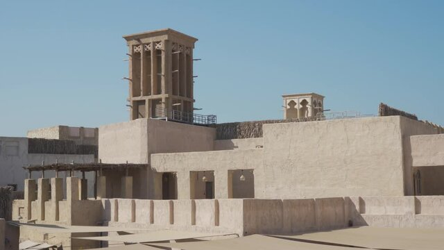 Windcatcher - Wind Tower On Traditional Buildings In Al Fahidi Historical Neighborhood In Dubai, UAE. - wide shot