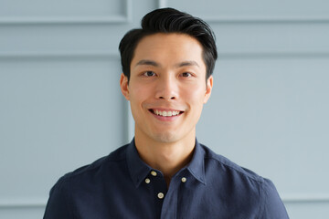 Portrait young confident smart Asian businessman look at camera and smile - obrazy, fototapety, plakaty