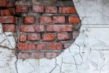  Aged red brick wall with a crack. Grunge style. Creative photo for the designer. Copy space. , the problem of major repairs of houses