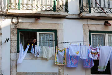 Washing hanging out to dry on the street: Travessa de Santa Luzia, Alfama, Lisbon, Portugal
