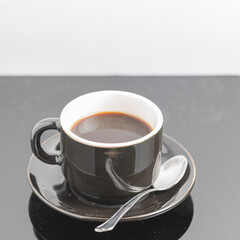 A cup of coffee over a black board