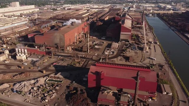 View Of AK Steel Caster Plant And Ford Industrial Building At Rouge River In Detroit - drone pullback