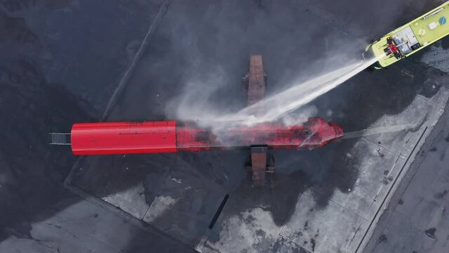Scania fire truck extinguishing replica airplane fire during training
