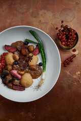 delicious Hummus dish with berries, veggies and sauce in restaurant background. Hummus dish for restaurant