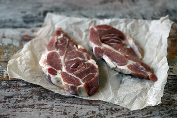 Fresh raw meat steak on paper. Marble steaks. Pork. Copy space.