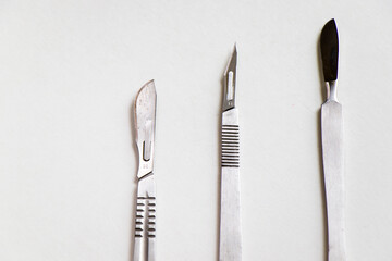 Surgery blade on the sterile table, scalpel close-up, operation equipment
