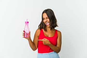 Young latin woman holding a milkshake isolated on white background