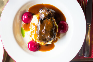 beef cheek with mashed potatoes and currant oil