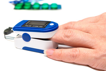 Determination of the level of oxygen in the blood during viral lung infection. Measurement of saturation with a portable pulse oximeter is isolated on a white background.