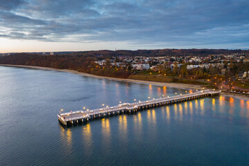 Fototapeta na wymiar Beautiful landscape with wooden pier in Gdynia Orlowo before sunrise, Poland