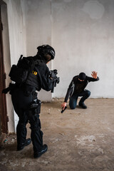 Man reenacting special unit of Croatian military police. Wearing green jumpsuit with black add-ons...