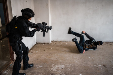 Man reenacting special unit of Croatian military police. Wearing green jumpsuit with black add-ons...