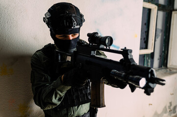 Man reenacting special unit of Croatian military police. Wearing green jumpsuit with black add-ons...