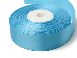 spools with blue satin ribbon on a white background