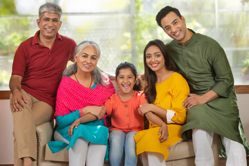 Portrait of a joint family in the living room