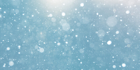 winter snow fall bokeh on blue background. 
snow flakes.