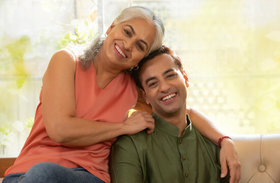 Portrait of a Mother and son in the living room 	
