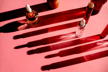 Glass Bottles with fluid collagen and hyaluronic acid, hydration skin. Top flatlay view copyspace. Natural background