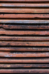 Background Texture. Stack of Old Roof Tiles. Side View