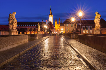 Old Main Bridge, Alte Mainbrucke with statues of saints, Cathedral and City Hall in Old Town of Wurzburg at night, Franconia, Bavaria, Germany