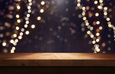 A wood table, tabletop product display  with a festive Christmas background of hanging fairy lights...
