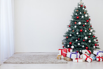 New Year's decoration Christmas tree with gifts and garlands