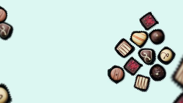 Animation of various chocolate candies on blue background