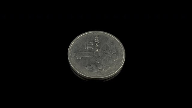 1 chinese yuan coin from 1997 on a black background
