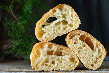 ciabatta fresh bread yeast-free sourdough or yeast dough pore structure on the table healthy snack ingredient top view copy space food background rustic