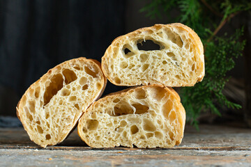 ciabatta fresh bread yeast-free sourdough or yeast dough pore structure on the table healthy snack ingredient top view copy space food background rustic