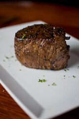 Steak. Grass-fed skirt steak, grilled to a medium rare and served with a garlic herb butter sauce and paired with roasted potatoes and Brussels sprouts. Classic American steakhouse favorite.