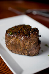 Steak. Grass-fed skirt steak, grilled to a medium rare and served with a garlic herb butter sauce and paired with roasted potatoes and Brussels sprouts. Classic American steakhouse favorite.