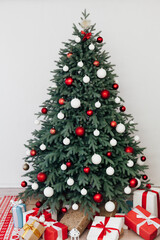 Christmas tree decor with gifts and garlands interior new year
