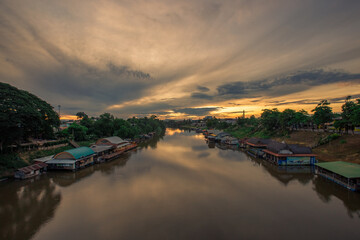 Fototapeta premium The background of religious attractions in Phitsanulok Province (Wat Chan Tawan Tok) has a distinctive golden yellow sculpture, close to the Nan River, tourists always come to make merit in Thailand