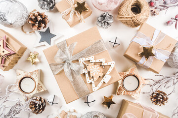 Festive Christmas background with different size gift boxes and Christmas decorations.