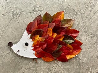 Children's crafts, hedgehog made of autumn leaves,