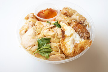 Delicious Vietnamese Bo Bun prepared with rice vermicelli noodles for basics and for topping chicken pieces and fried spring rolls