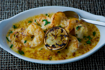 Shrimp risotto sautéed in organic butter, garlic and served with jumbo lump crab cake, cauliflower, broccoli and potatoes. Classic American restaurant or French bistro entree favorite.