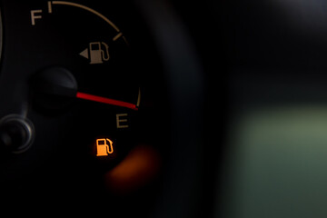 Empty fuel warning light in car dashboard. Fuel pump icon. gasoline gauge dash board in car with...