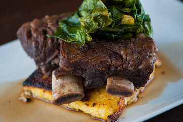 Beef shank. Grade A grass fed angus beef steaks. Tenderloin, filet mignon, New York strip, bone in rib-eye grilled medium rare on outdoor wood-fired grill. Classic American steakhouse entree favorite.