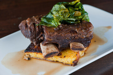 Beef shank. Grade A grass fed angus beef steaks. Tenderloin, filet mignon, New York strip, bone in rib-eye grilled medium rare on outdoor wood-fired grill. Classic American steakhouse entree favorite.