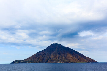 Sicily, Italy. The volcanic island of Stromboli rises from the Tyrrhenian Sea.