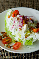 Wedge Salad. Iceberg Lettuce, blue cheese dress and shredded carrots. Classic American steakhouse or restaurant favorite. 