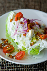 Wedge Salad. Iceberg Lettuce, blue cheese dress and shredded carrots. Classic American steakhouse or restaurant favorite. 