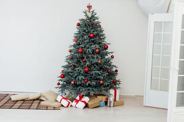 Christmas tree decor with gifts and garlands interior new year