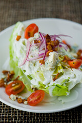 Wedge Salad. Iceberg Lettuce, blue cheese dress and shredded carrots. Classic American steakhouse or restaurant favorite. 