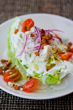 Wedge Salad. Iceberg Lettuce, Blue Cheese Dress And Shredded Carrots. Classic American Steakhouse Or Restaurant Favorite. 