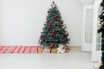 Christmas tree decor with gifts and garlands interior new year