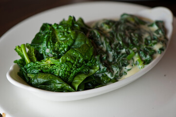 Creamed spinach roasted in garlic, onions, olive oil and fresh herbs and spices. Classic American steakhouse or French bistro appetizer or side dish.