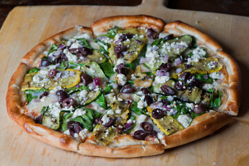 Pizza. Hand rolled pizza dough, topped with homemade tomato sauce seasoned with garlic, basil leaves salt and peppers. Topped with pepperoni and shredded mozzarella cheese then baked to a golden crisp
